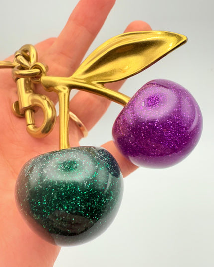 Purple & Green Glitter Cherry Keychain – Dual-Color Resin Fruit Charm with Gold Stem | Cute Statement Bag Accessory